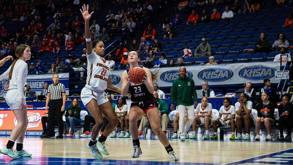 Taylor County’s Riley Sprowles, right, looks to get up a shot against Frederick Douglass’ Jaelee Knowles during Friday’s Sweet 16 quarterfinal matchup in Rupp Arena. Knowles led the Broncos to victory with 21 points, 11 rebounds and six blocks.
