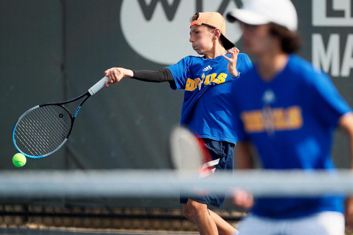Henry Clay’s Niko Klyachkin returned the ball during his boys’ doubles match against Madison Southern during the 11th Region Tennis Tournament at Top Seed Tennis Club in Nicholasville.