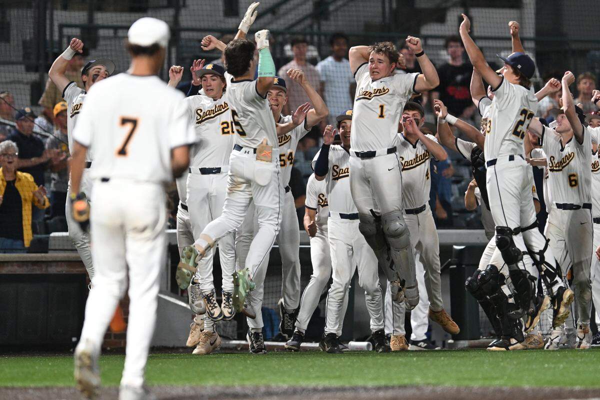 Sayre’s Gary Gibson (5) leaps into the air during the Spartans’ celebration of his third inning home run against Johnson Central in the first round of the Baseball State Tournament presented by UK HealthCare at Legends Field on Thursday. Photos available for purchase via Danny Vaughn Photography.