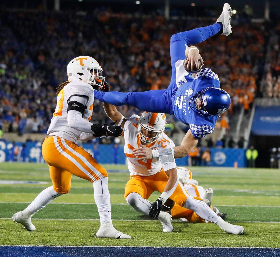 Kentucky Wildcats quarterback Will Levis (7) leaps for a touchdown over Tennessee Volunteers linebacker Aaron Beasley (24) during a game at Kroger Field in Lexington, Ky., Saturday, Nov. 6, 2021.