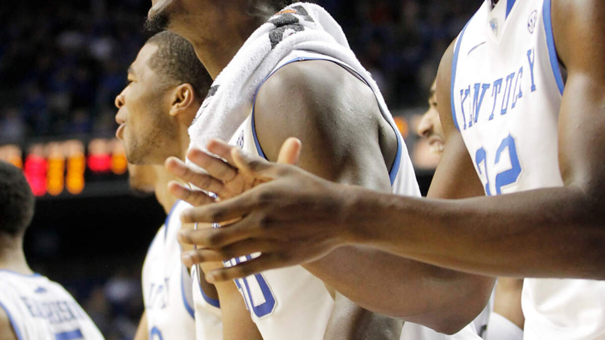 Kentucky's Julius Randle, left and Alex Poythress cheered from the bench after EJ Floreal scored in the second half of the Robert Morris at Kentucky men's basketball game at Rupp Arena in Lexington, Ky., on Nov. 17, 2013. Photo by Pablo Alcala | Staff 