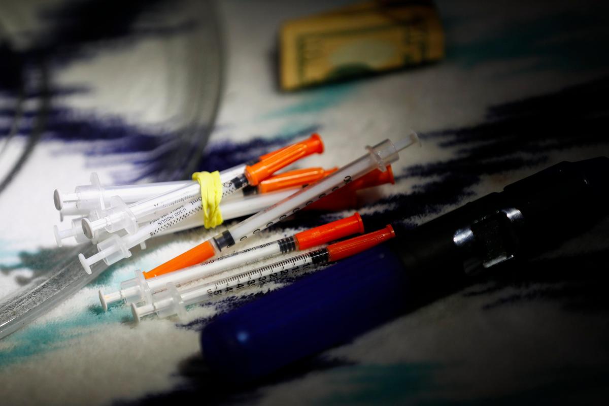Syringes, cash and other drug paraphernalia in a home on Lancelot Court in Pikeville, Ky., Thursday, Aug. 8, 2019. Three people in the home were arrested for methamphetamine related offenses.