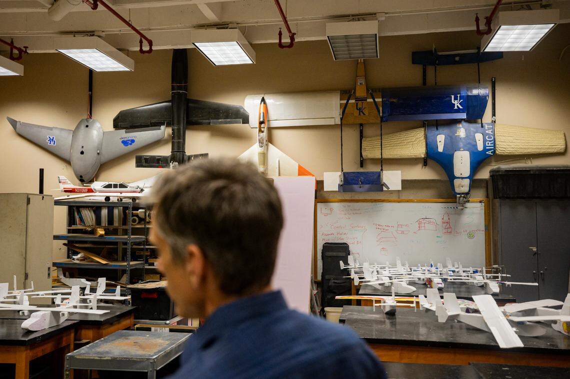 Sean Bailey, UK mechanical and aerospace engineering professor, looks at some of the drones from previous years on Monday, July 14, 2025, at the University of Kentucky campus in Lexington, Ky.