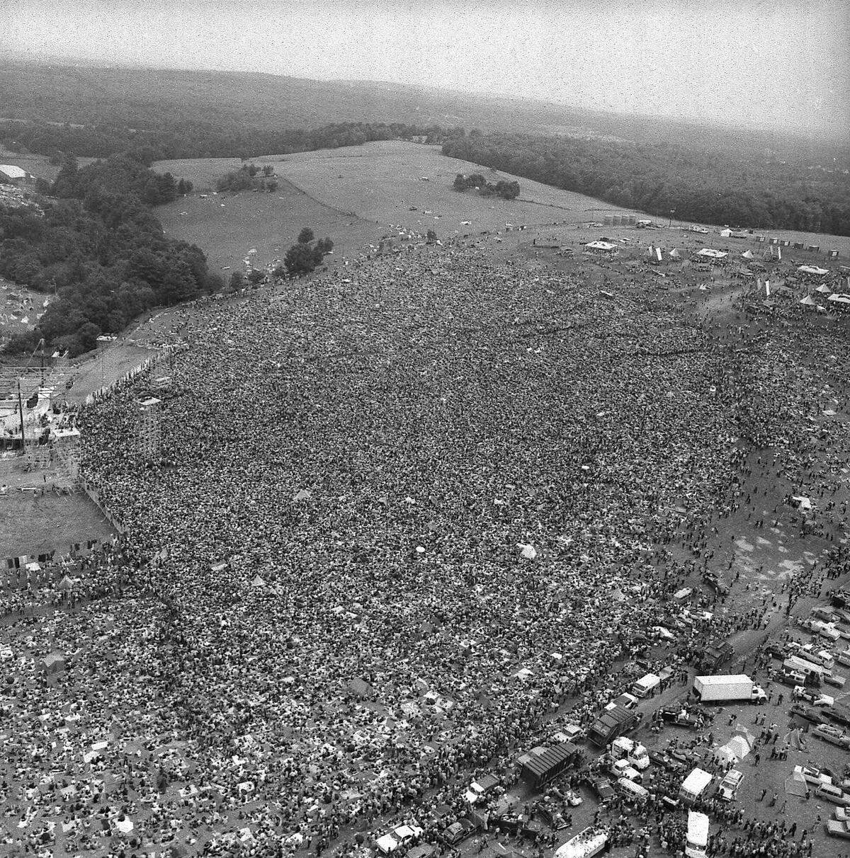 This Aug. 16, 1969 photo shows a crowd of about 400,000 people attending the Woodstock Music Festival in Bethel, N.Y. Woodstock was staged 80 miles northwest of New York City on a bucolic hillside owned by dairy farmer Max Yasgur. This weekend marks the 50th anniversary of the festival famously billed as “3 Days of Peace and Music.”