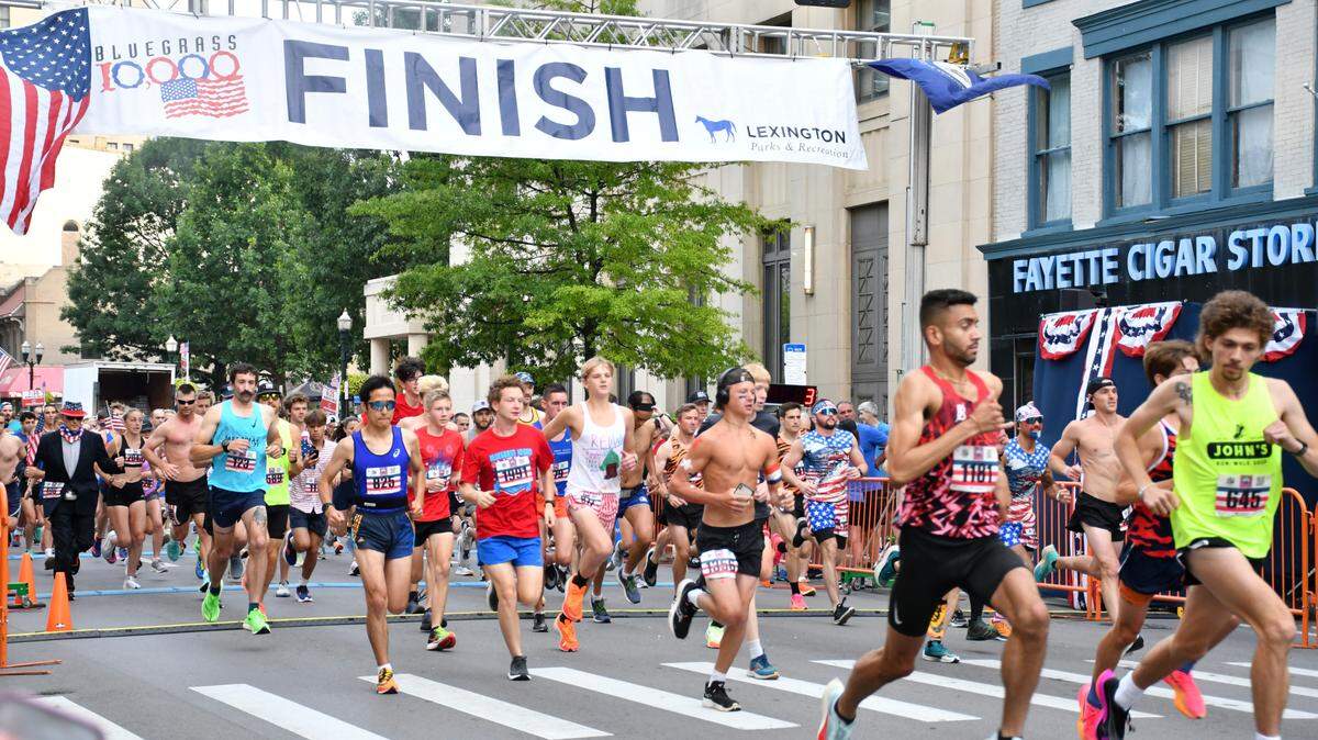 Runners begin the Bluegrass 10,000 on Main Street in Lexington on Tuesday. The race marked the beginning of the day’s Fourth of July celebrations, with a festival and market, parade, and fireworks show to follow.