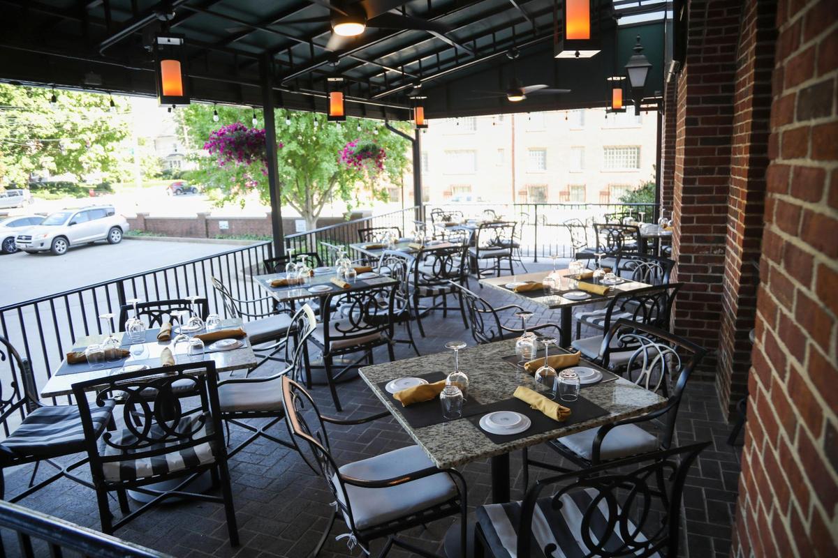 The patio at La Folie is elevated and off of Main Street, giving diners a private oasis outdoors.