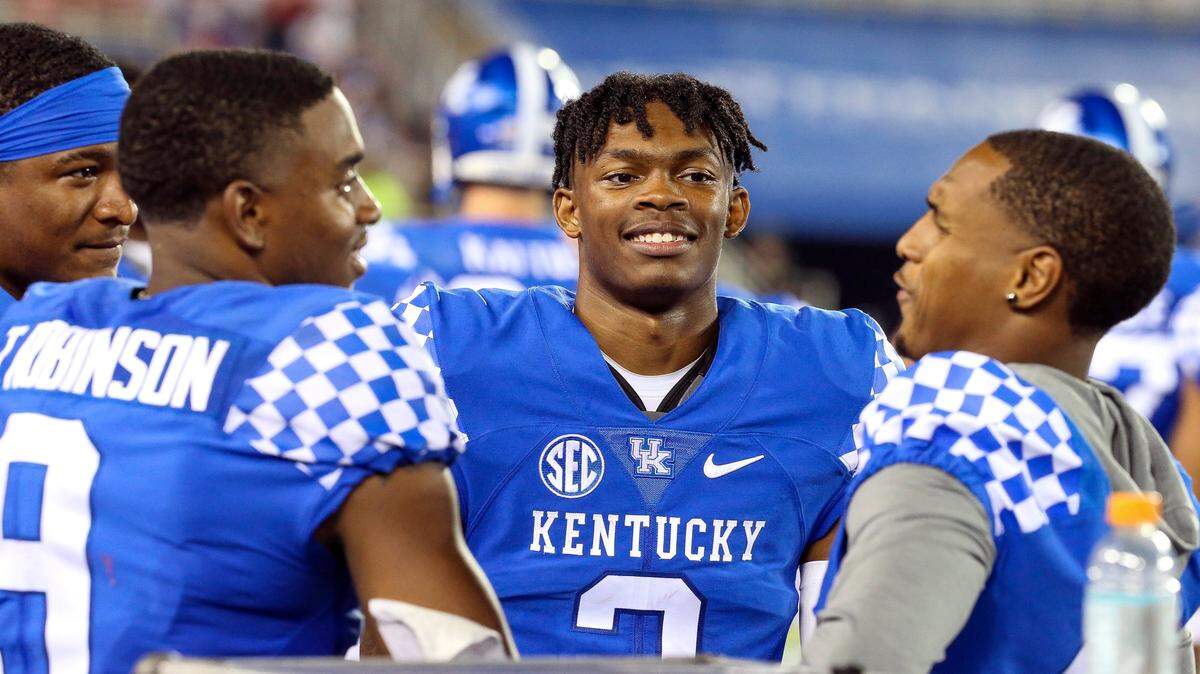 Kentucky wide receiver Barion Brown, center, returned a kick for a touchdown in his college football debut against Miami (Ohio).