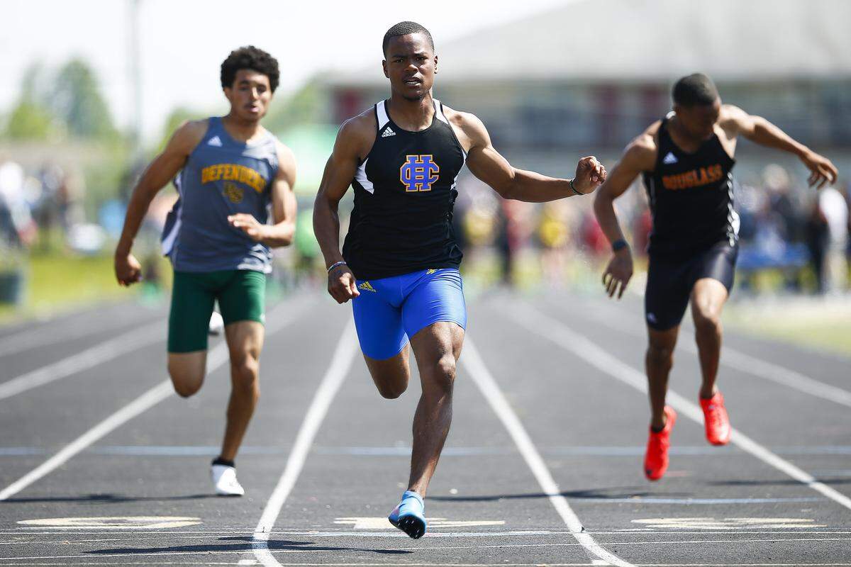 Henry Clay’s Langston Jackson, center, won the boys’ 100-meter dash at last weekend’s Class 3A, Region 6 meet in Lexington, followed by Bryan Station’s Anthony Franklin, left, and Frederick Douglass’ Maliq Trigg.