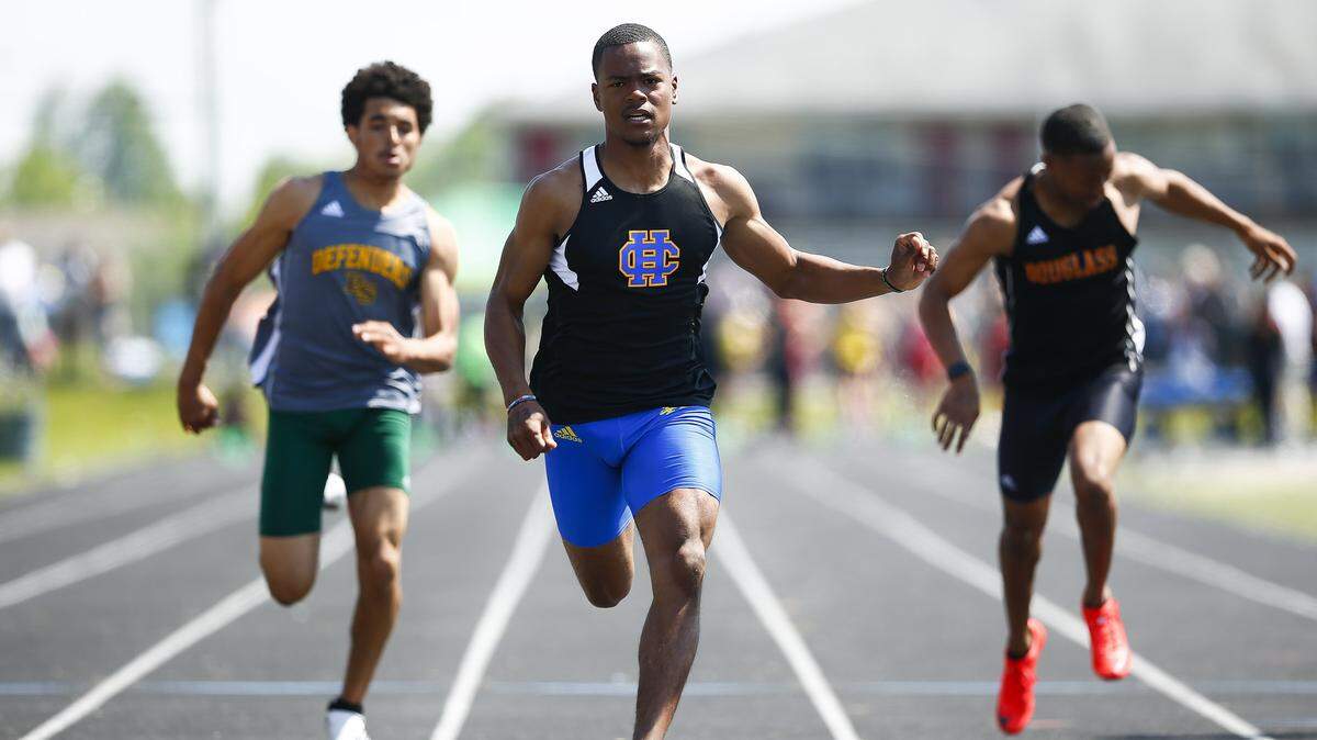 Henry Clay’s Langston Jackson, center, has won track and field state championships in eight events and still has his senior season to go.