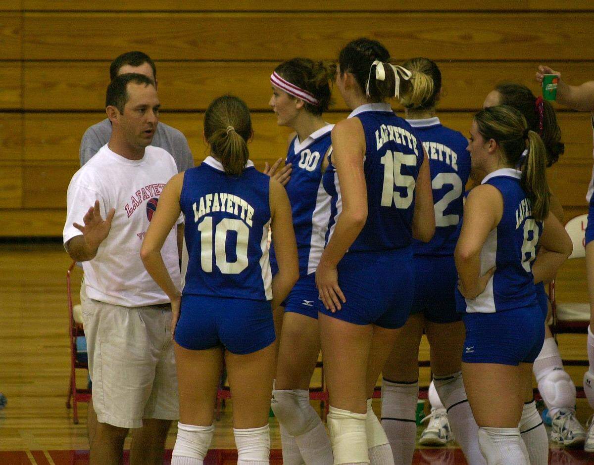 2002 file photo: Lafayette volleyball coach Chris Langston talked to his team during a timeout as the Generals played Paul Laurence Dunbar.