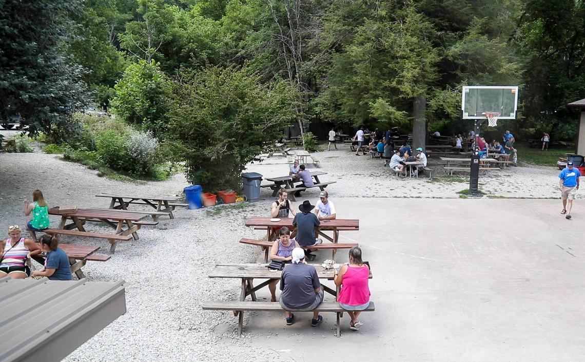 Patrons wait at picnic tables for their food outside of Miguel’s Pizza July 14 in Red River Gorge. Miguel’s Pizza has become somewhat of a tourist attraction, seeing customer growth every year.