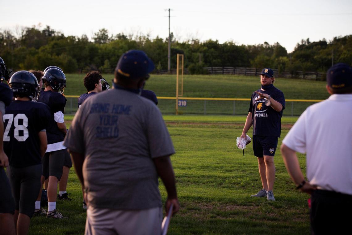 Sayre head coach Chad Pennington, a former star quarterback in the NFL, addressed his team at a recent practice. “What I’m all about is showing how our athletic program can partner with the academic side to develop the whole child,” he said.