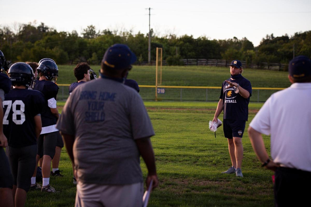 Sayre head coach Chad Pennington addresses his team during a practice on Sept. 4, 2020.