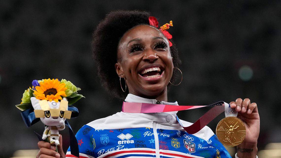 Former University of Kentucky star Jasmine Camacho-Quinn celebrated with her gold medal after winning the women’s 100-meter hurdles at the Tokyo Olympics.