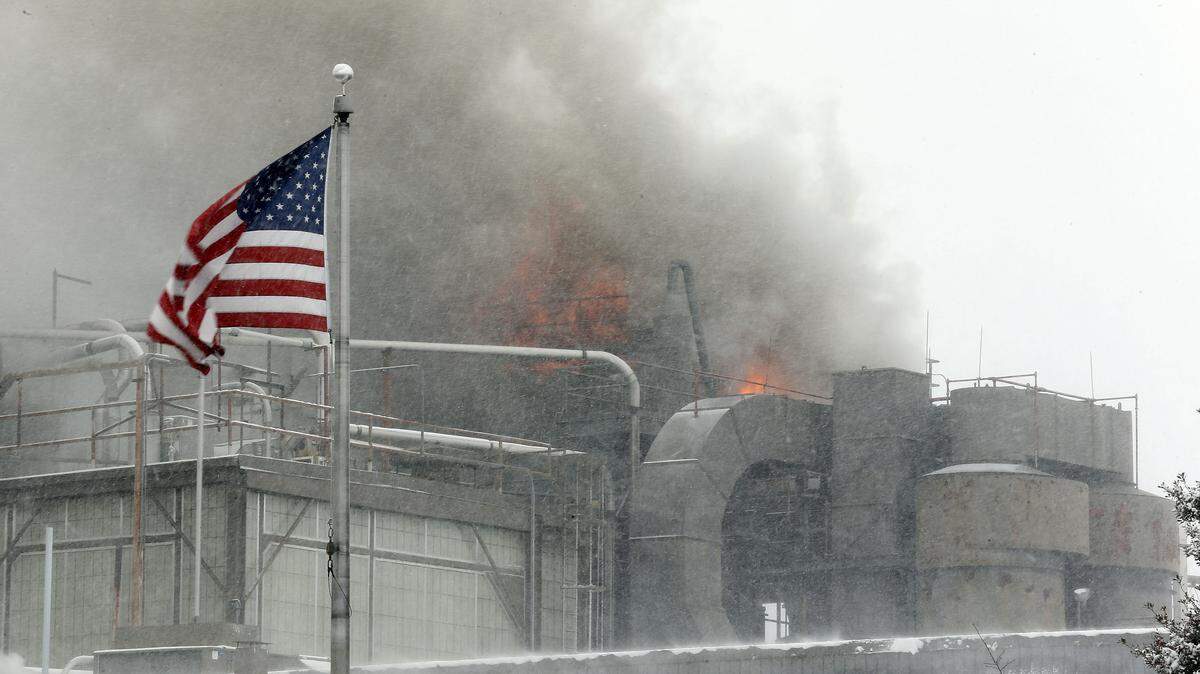 Fire department officials did not know if the roof of the peanut butter plant caught fire, or if the flames were shooting through vents. The cause of the blaze was not known Tuesday.