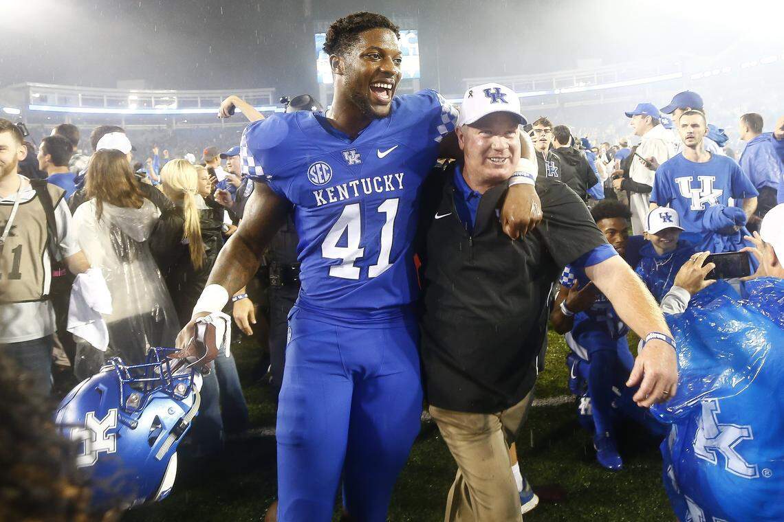 Josh Hines-Allen celebrated with head coach Mark Stoops after a victory over Mississippi State in 2018. Hines-Allen holds UK’s record for career sacks.