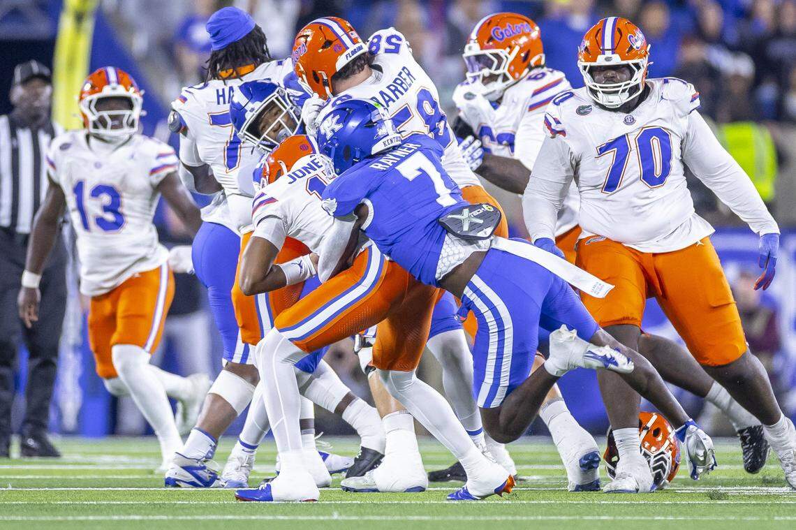 Kentucky linebacker Daveren Rayner (7) tackles Florida quarterback Tramell Jones Jr. during Saturday’s game at Kroger Field.