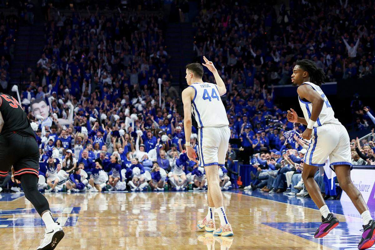 Kentucky forward Zvonimir Ivisic (44) celebrates scoring his first points, a 3-pointer, with the Wildcats during Saturday night’s game against Georgia.