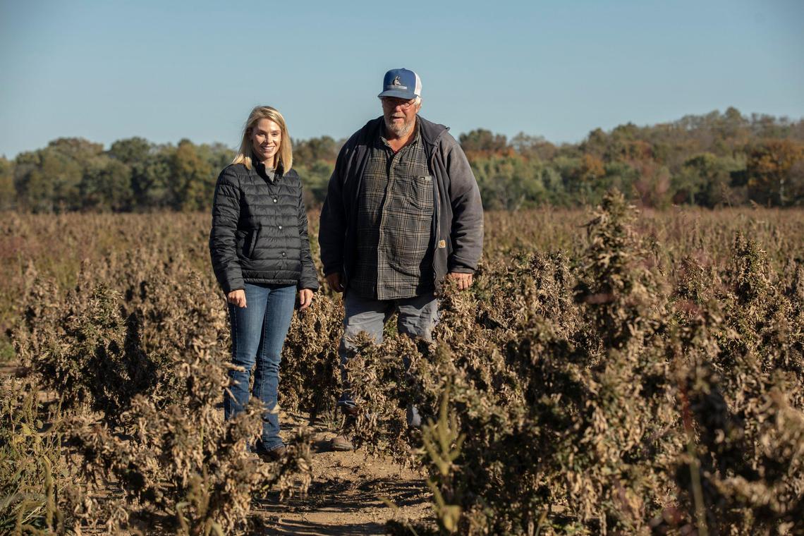 Kendall Henson, left, and Doug Dunaway stand in Dunaway’s hemp field near Berry. They are part of a group that has sued GenCanna.