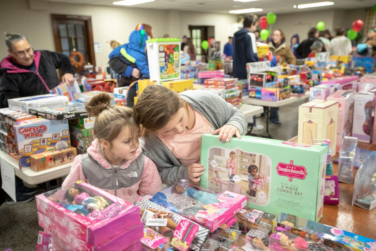 CayleeAnn Yount, 7, left, and Jaylin Robinson, 9, pick out toys at Harlan Baptist Church in Harlan, Ky., donated by Heritage Baptist Church in Lexington to benefit families impacted by coal company bankruptcies Saturday, Dec. 14, 2019.