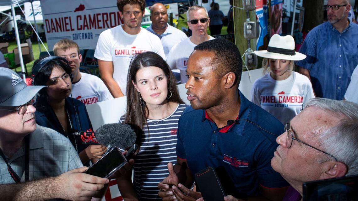 Kentucky Attorney General Daniel Cameron talks with reporters before politicians give speeches during the 142nd annual St. Jeromes Fancy Farm Picnic in Fancy Farm, Ky., Saturday, August 6, 2022.