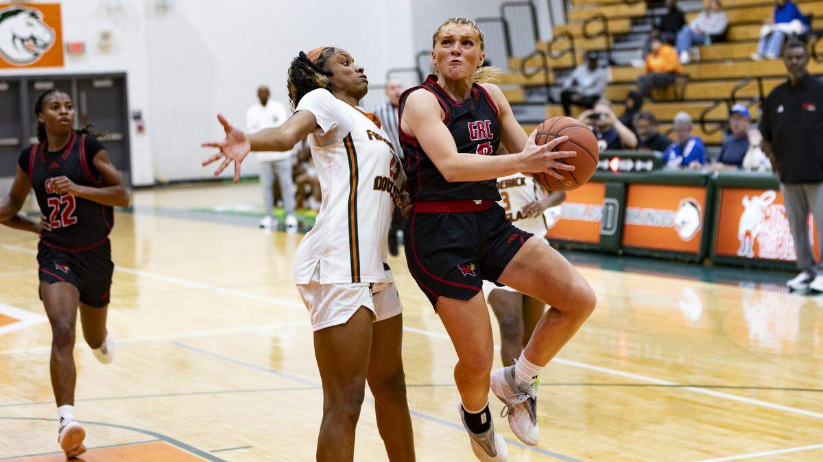 George Rogers Clark’s Kennedy Stamper, right, drove in for a layup against Frederick Douglass’ Jaelee Knowles during their game in the Douglass Holiday Showcase at The Farm on Saturday.