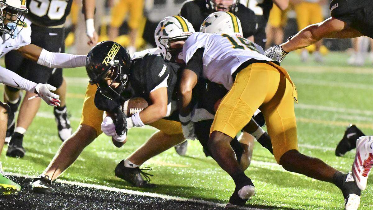 Boyle County’s Ji’Dyn Smith-Hisel breaks through St. Xavier’s defense for a first-half touchdown in the Rebels’ 14-3 win at Boyle County High School in Danville on Friday.