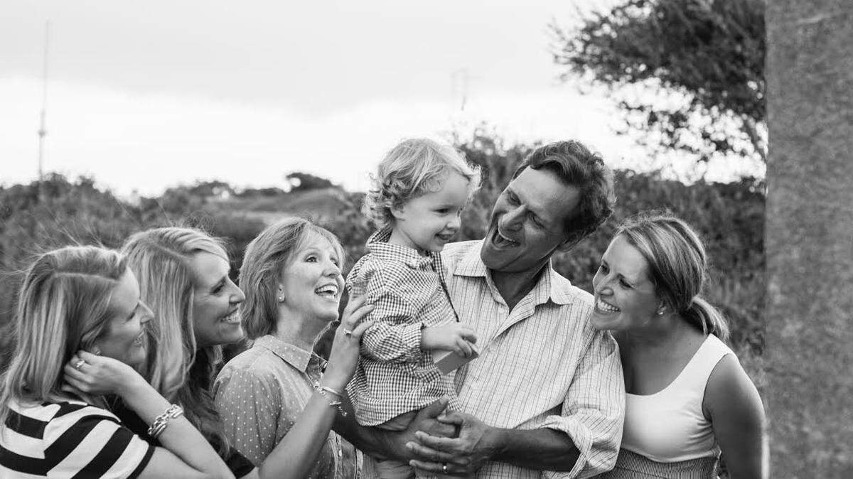 Mark Hinkel, flanked by daughters Andrea, left, and Kaci Hinkel, wife Mary-Lynn Hinkel, and daughter Lauren Lewis, held grandson Henry Lewis. Henry is one of Hinkel's two grandchildren.  