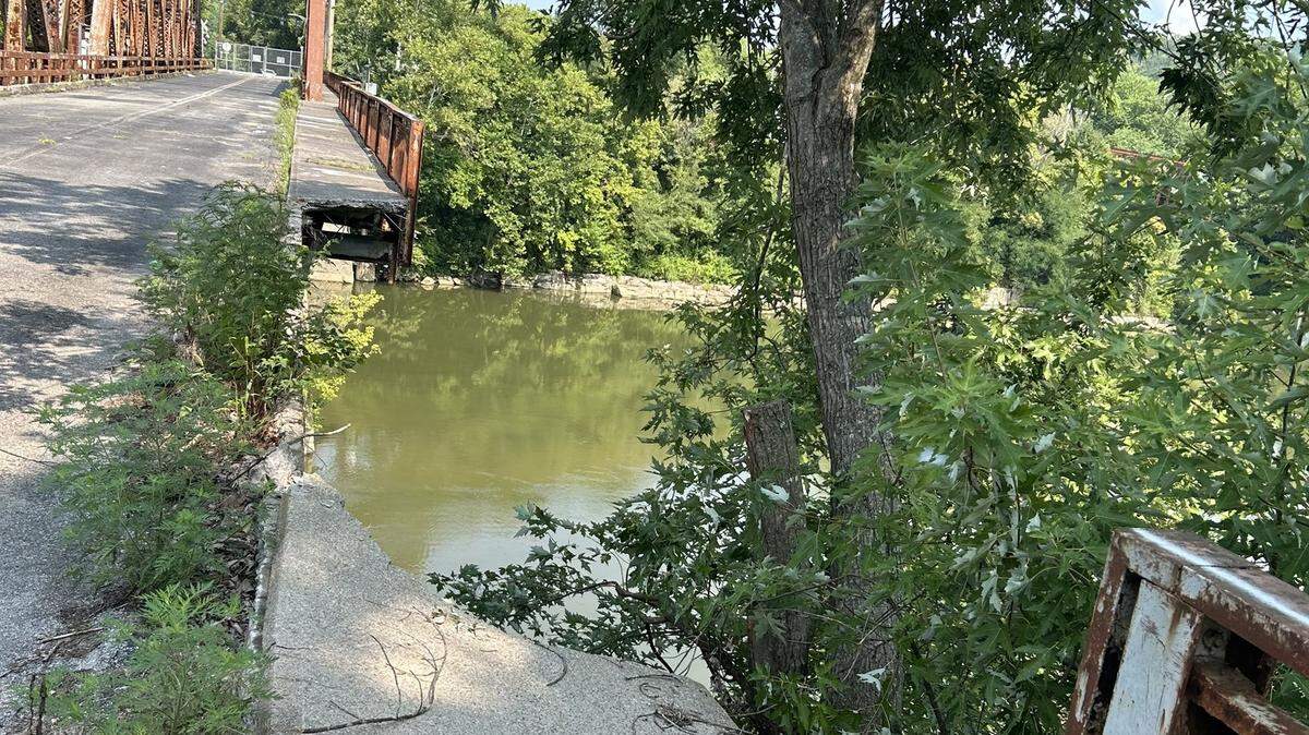 A section of sidewalk on the Broadway Bridge in Frankfort collapsed into the Kentucky River, forcing the closure of a section of the river.