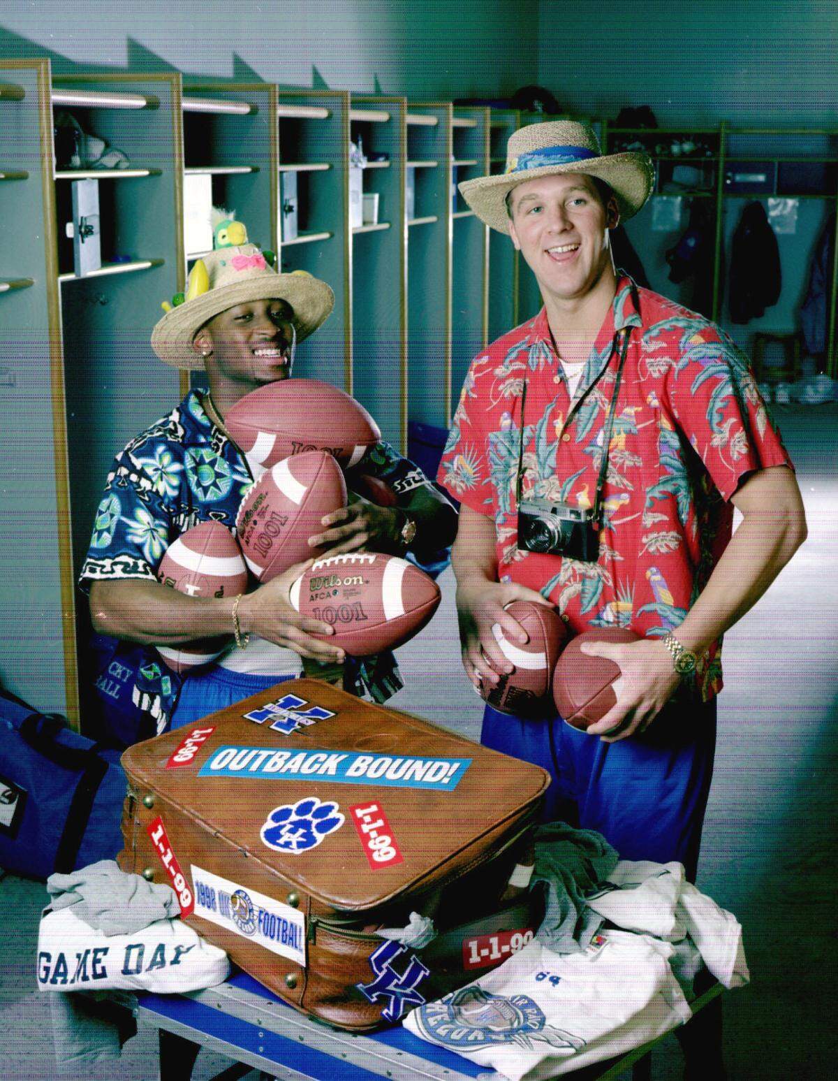In preparation for the 1999 Outback Bowl, UK players Craig Yeast, left, and Tim Couch posed for a bowl preview photo in UK’s locker room.