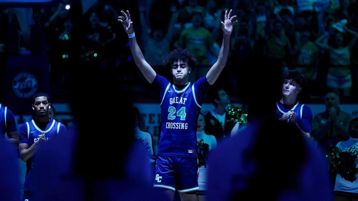 Great Crossing’s Malachi Moreno (24) waves to the crowd before the Warhawks took on Bowling Green in Rupp Arena on Saturday night.