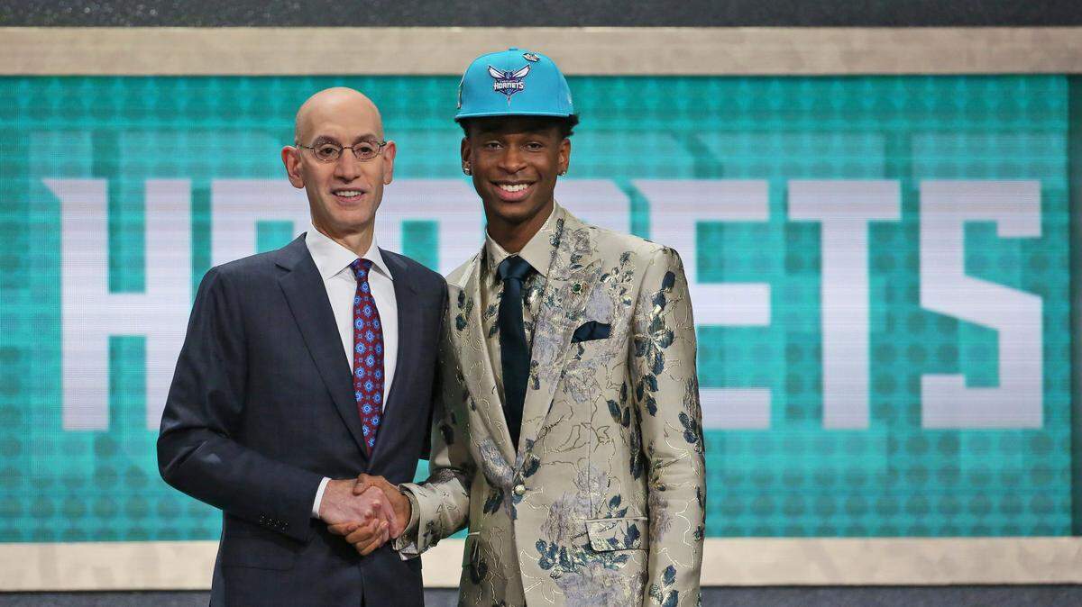 Former Kentucky guard Shai Gilgeous-Alexander, right, posed with NBA Commissioner Adam Silver after he was picked 11th overall by the Charlotte Hornets. After an immediate trade, Gilgeous-Alexander is now with the Los Angeles Clippers.