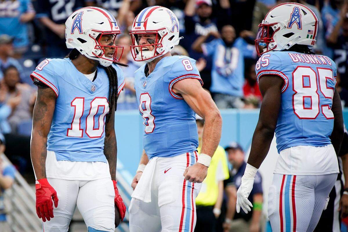 Titans quarterback Will Levis (8) reacts after wide receiver DeAndre Hopkins (10) caught a touchdown pass against the Falcons during the first quarter in Nashville.