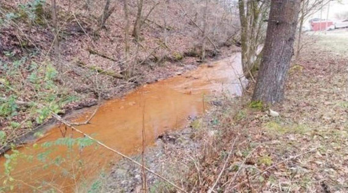 A stream in Eastern Kentucky was stained orange by polluted water from an underground coal mine in this Jan. 20, 2021 photo.