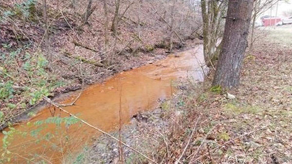 A stream in Eastern Kentucky was stained orange by polluted water from an underground coal mine in this Jan. 20, 2021 photo.