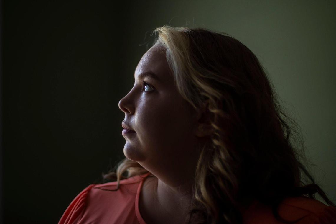 Destinee Ott poses for a portrait at her home in Beattyville, Ky., on Tuesday, July 12, 2022. Ott, 25, made the decision to get her tubes tied after the reversal of Roe. She’s one of many women seeking out this option, in part because she lives with two diseases that would make pregnancy very hard for her.