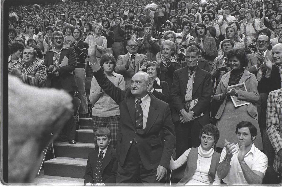 Former University of Kentucky basketball coach Adolph Rupp waved to the fans as he was introduced at the first UK game in Rupp Arena on Nov. 27, 1976. UK played Wisconsin and won 72-64.