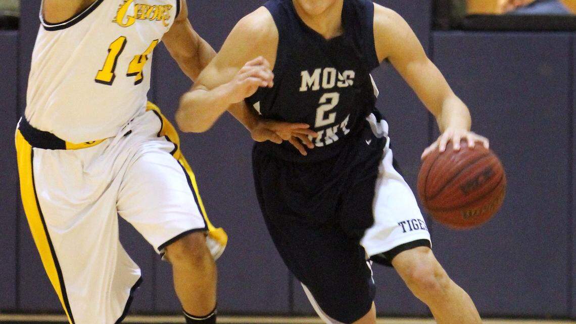 Devin Booker of Moss Point High School in Mississippi was guarded by Gautier's Denzell Packnett on Jan. 25, 2013. Booker announced Thursday afternoon that he will attend Kentucky.