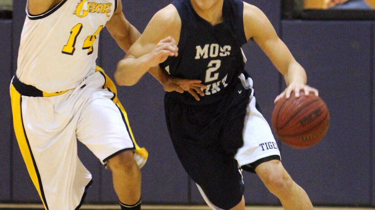 Devin Booker of Moss Point High School in Mississippi was guarded by Gautier's Denzell Packnett on Jan. 25, 2013. Booker announced Thursday afternoon that he will attend Kentucky.