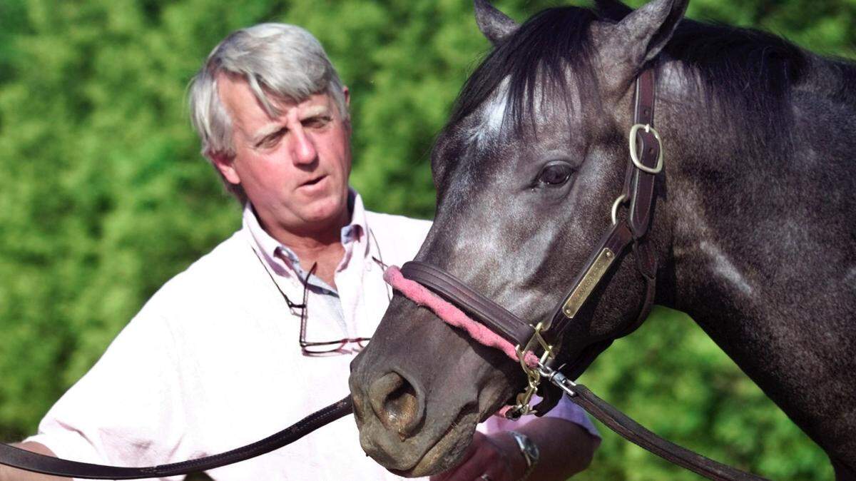 Trainer John Ward checked on Kentucky Derby winner Monarchos as he prepared to run in the Preakness Stakes at Pimlico Race Course. The 2001 Kentucky Derby winner went on to finish sixth in the Preakness and third in the Belmont that year. Ward died Saturday at age 75.