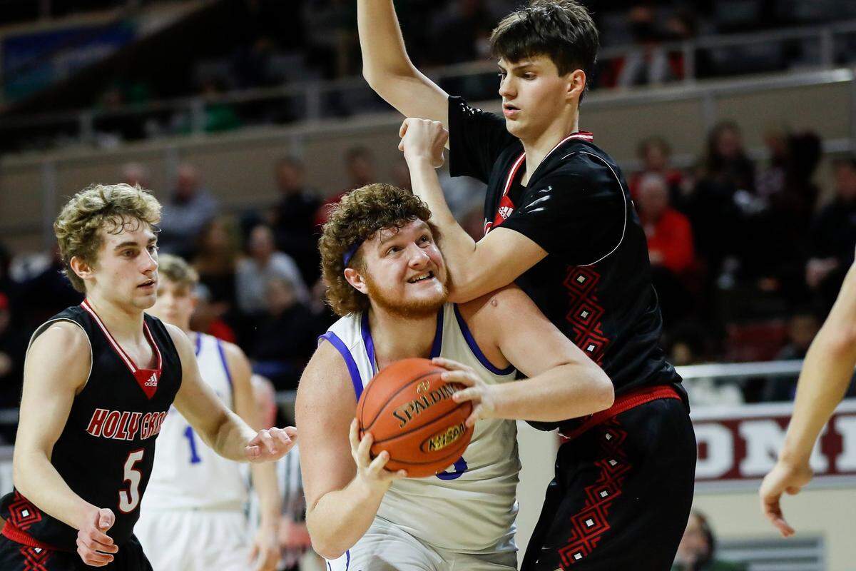 Breathitt County’s Bryce Hoskins (5) drives against Sam Gibson (55) of Covington Holy Cross during Friday night’s quarterfinals. Hoskins finished with 15 points and 16 rebounds.