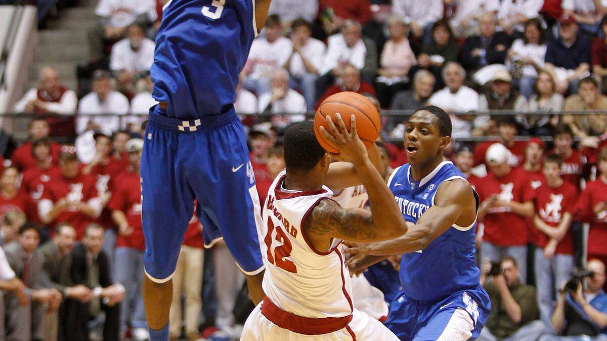 Kentucky Wildcats forward Terrence Jones (3) and Kentucky Wildcats guard Brandon Knight (12) pressured Alabama Crimson Tide guard Trevor Releford (12) as Alabama defeated #12 Kentucky 68-66 on Tuesday January  18, 2011 in Tuscaloosa, AL. Photo by Mark Cornelison | Staff