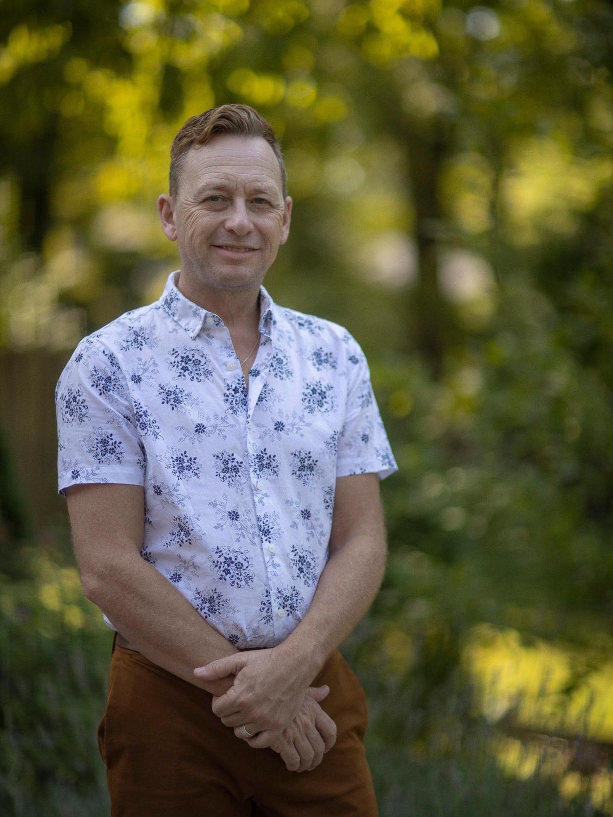 Silas House poses for portrait at his home in Lexington, Ky., on Wednesday, Sept. 21, 2022. House’s new novel, “Lark Ascending”, is set to be released Tuesday, Sept. 27.
