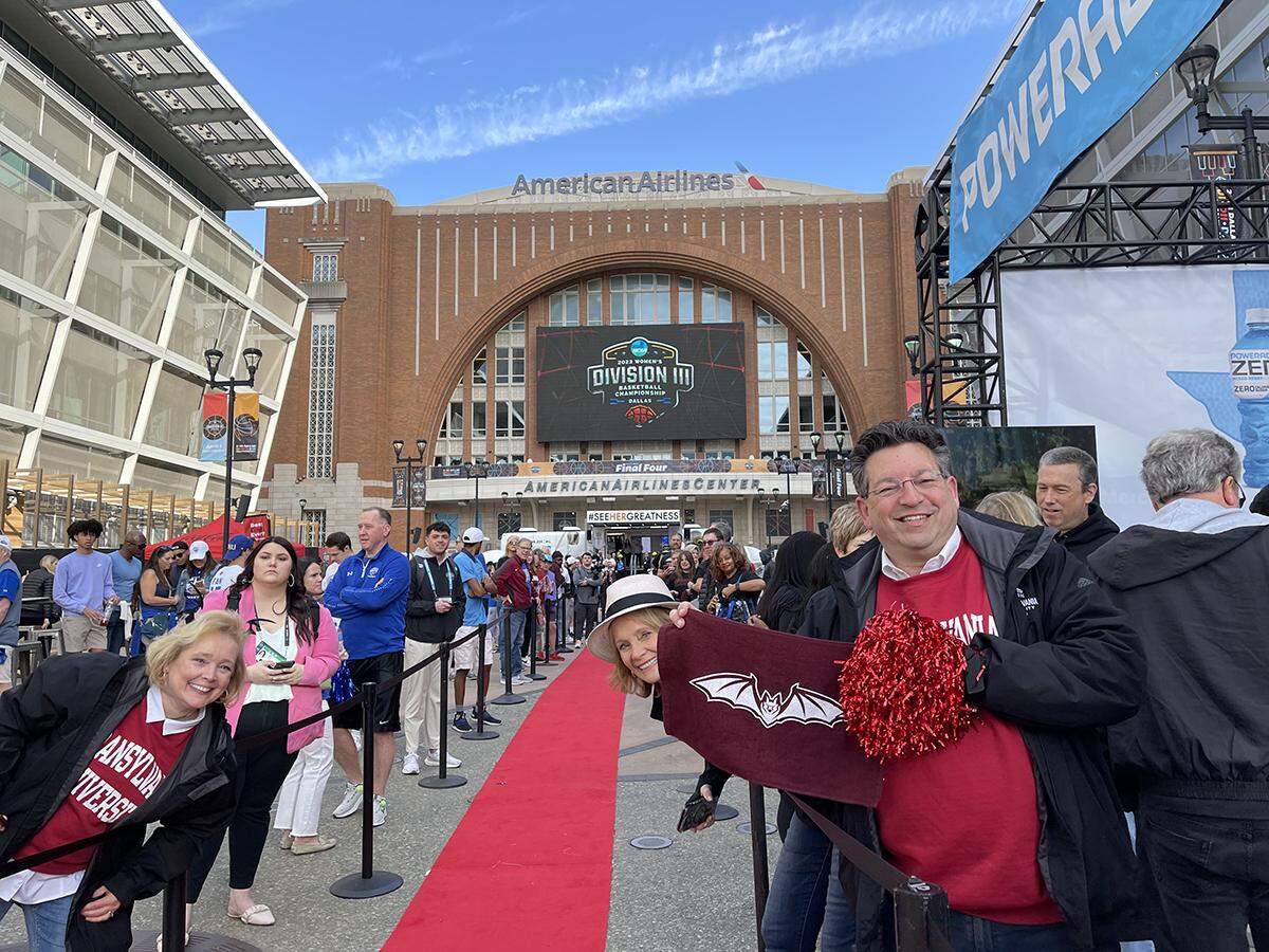 Transylvania women’s basketball fans line the red carpet while waiting for the team to arrive outside the American Airlines Center prior to the NCAA Division III Tournament championship game on Saturday in Dallas.