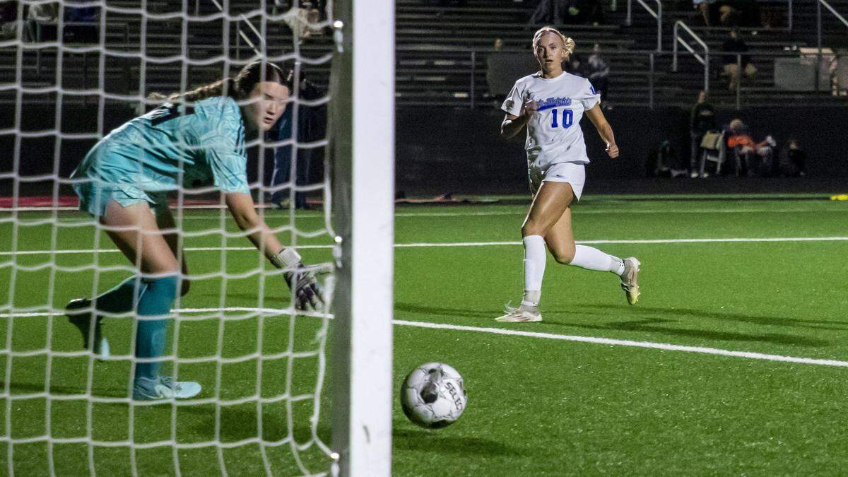 Lexington Catholic's Joanna Bryant (10) scores a goal past Frederick Douglass' Hannah Piatt (1) during the 11th Region girls' soccer semifinals Thursday, Oct. 16, 2025 at Scott County High School in Georgetown, Ky.