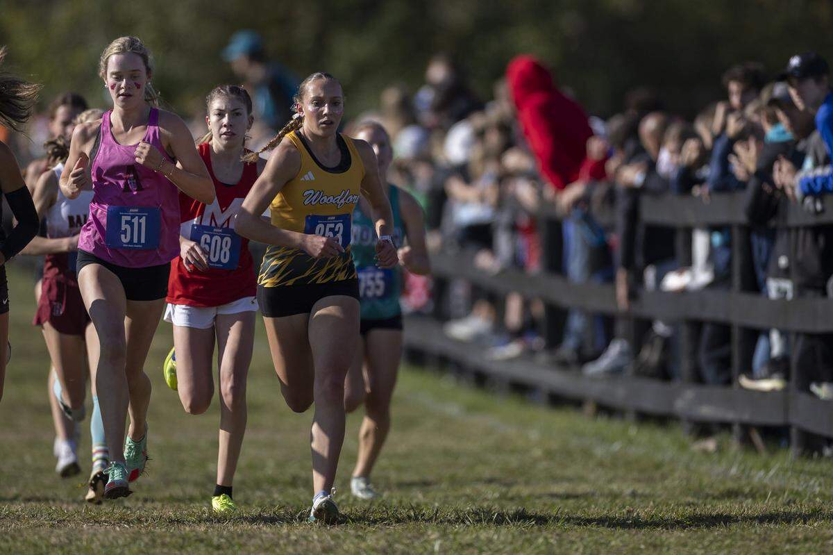 Woodford County's Addison Moore (853) competes during the 2025 KHSAA Class 1A State Cross Country Meet at the Kentucky Horse Park in Lexington, Ky., on Saturday, Nov. 1, 2025. Moore won the individual title. 