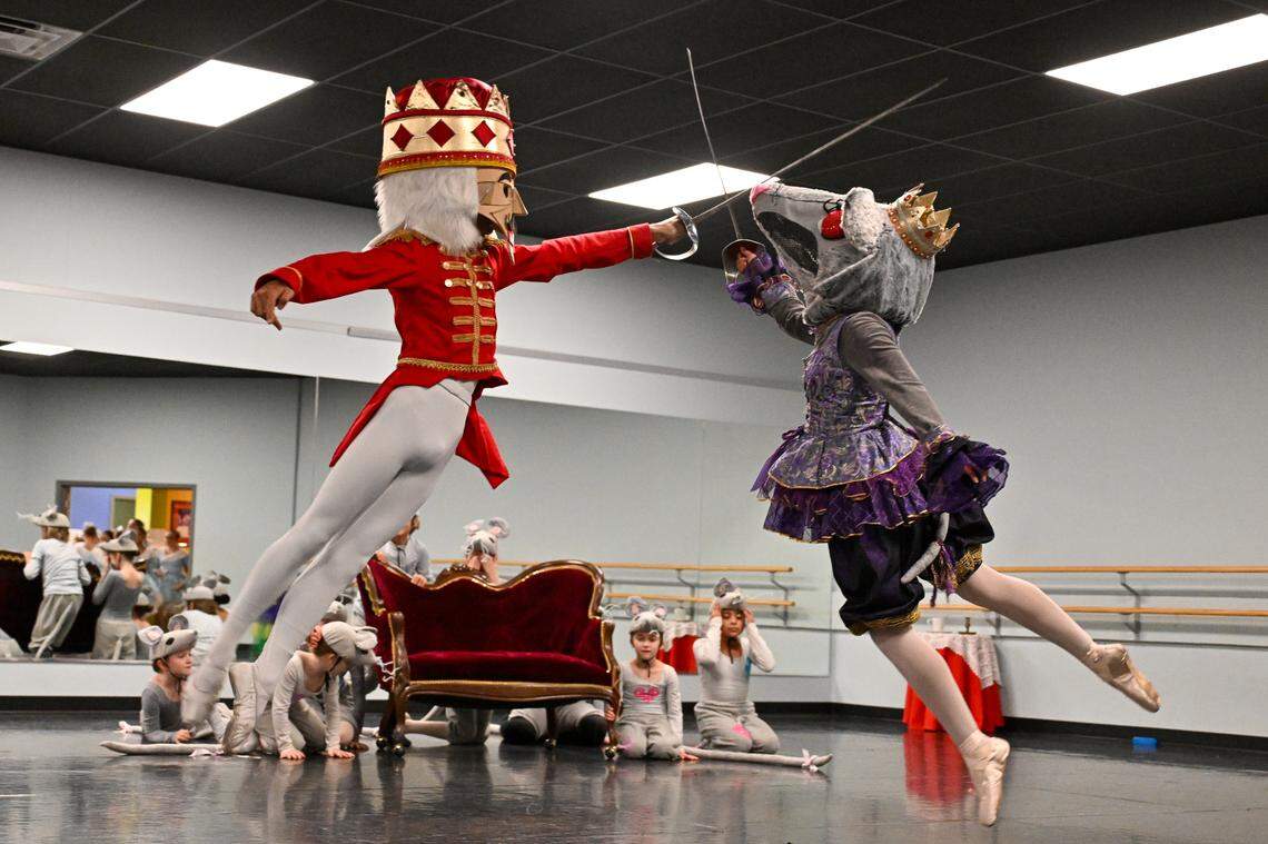 Noah Klanderud as the Nutcracker and Audrina Quinio as the Rat Queen battle.