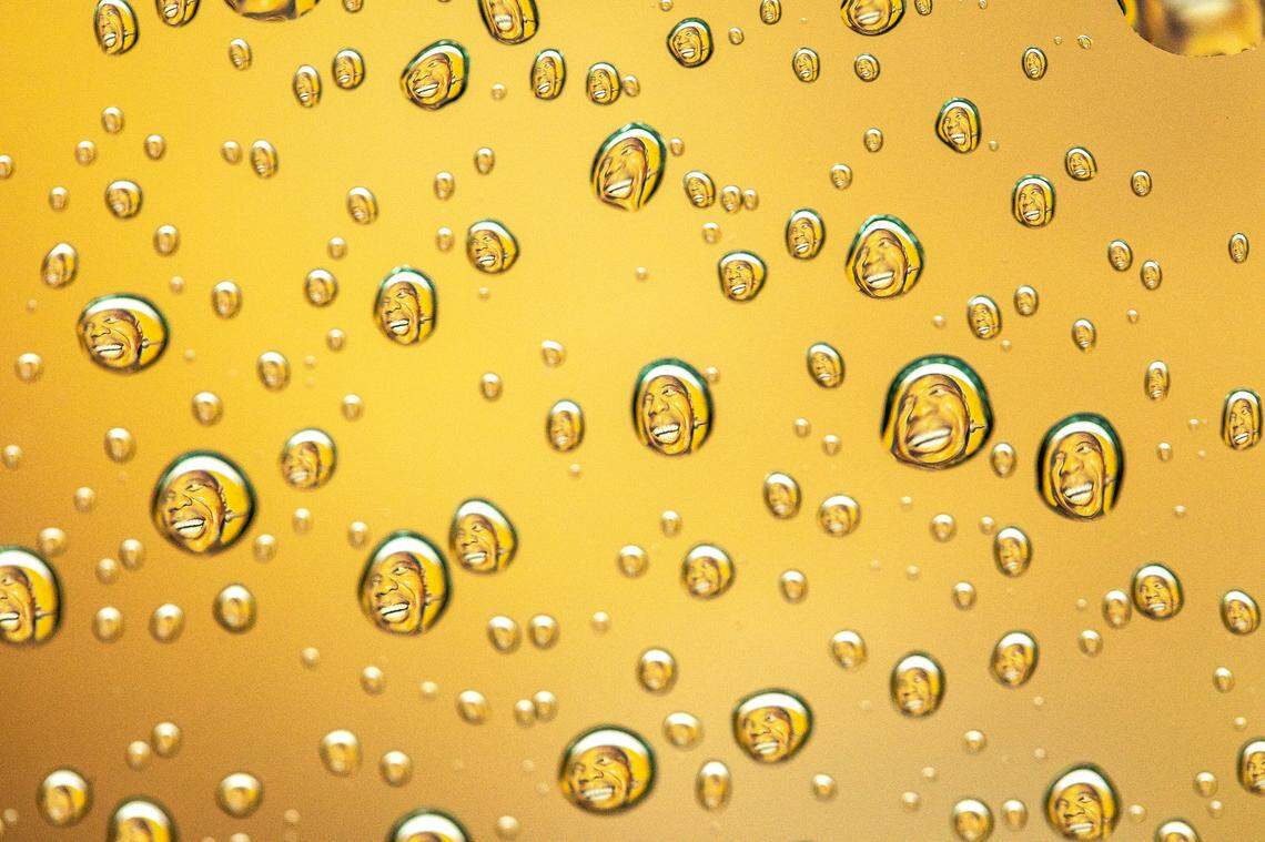 A mural of jazz great Louis Armstrong is reflected in raindrops Friday in Lexington. The mural, on the side of Lighthouse Ministries, 185 Elm Tree Lane, was created by Portuguese artist Sergio Odeith in 2015.
