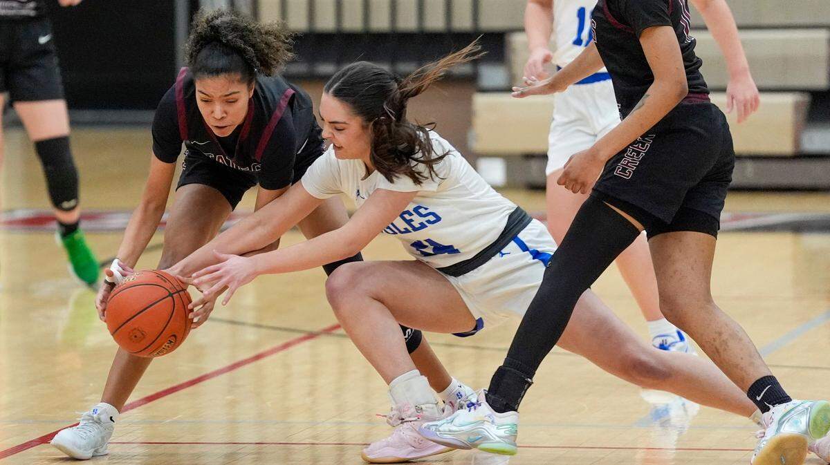 Tates Creek’s Alyiah Baird and Lexington Christian’s Claire Roberts battle for a loose ball. Roberts finished with 13 points.
