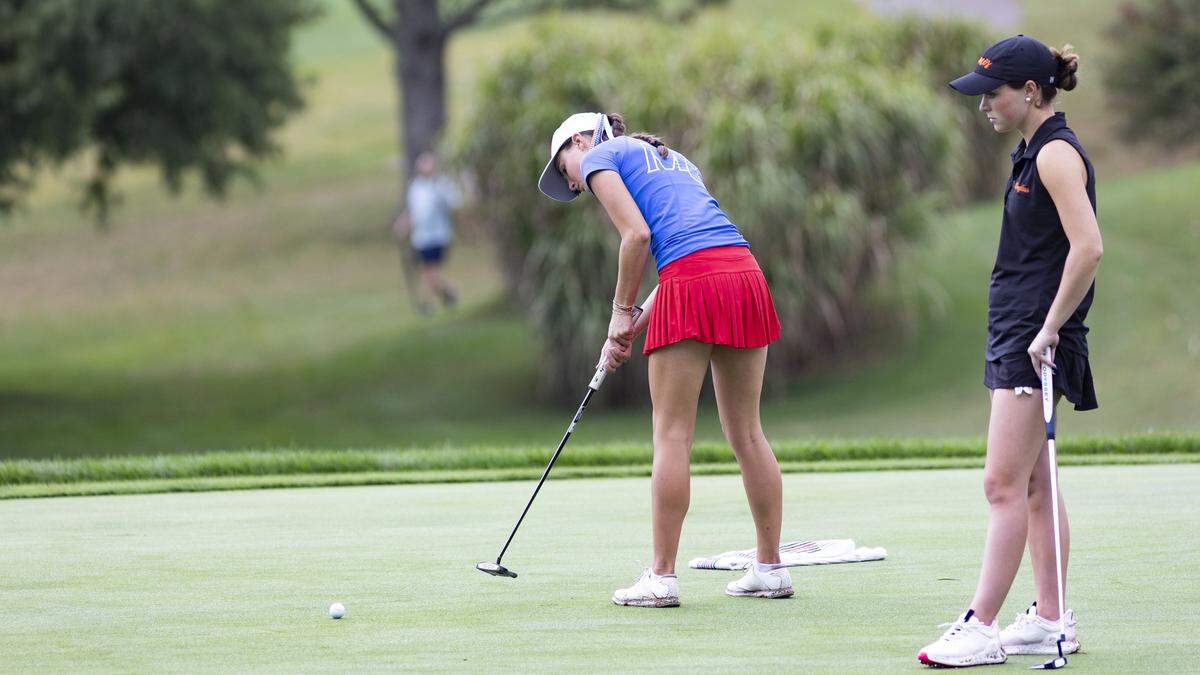 Madison Central’s Aubrey Barrow struck her putt on the 8th green at Lakeside Golf Course as Izzy Newland of Frederick Douglass awaited her turn during the 9th Region Girls Golf Championship on Wednesday.